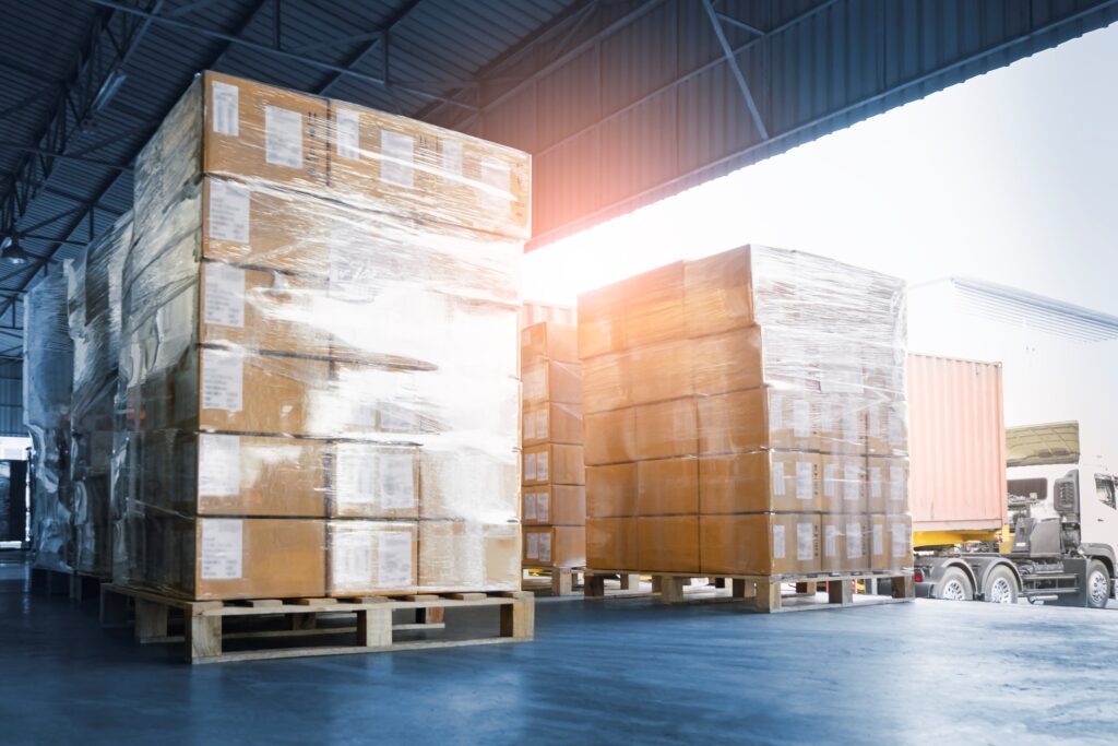 Stacked of Package Boxes Loading into Container Truck